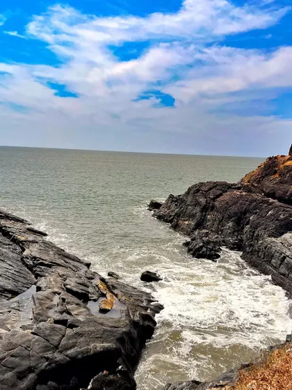 Waves crashing against the unique rock formations along the Gokarna coast. This is a view you get while trekking from Paradise Beach to Om Beach.