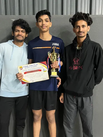 Shivaraj celebrating his win with his coaches. Our coaching team is the backbone of our students' success.