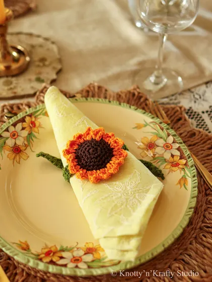 A single place setting, made special with a sunflower napkin tie.