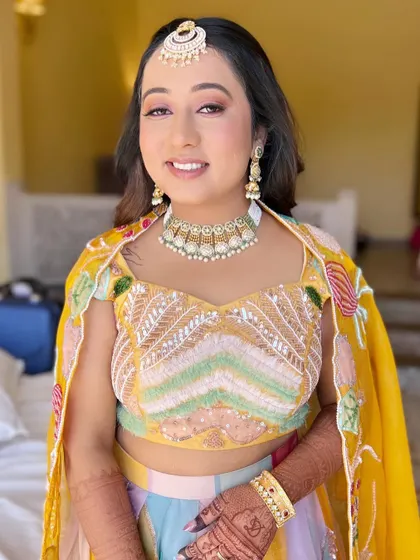 A bright and happy daytime look. The makeup is fresh and minimal, letting her natural beauty and colorful outfit shine.
