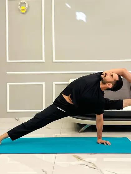 Holding Visvamitrasana, a pose dedicated to the sage Visvamitra. It's a powerful expression of strength, flexibility, and openness in the hips and shoulders.