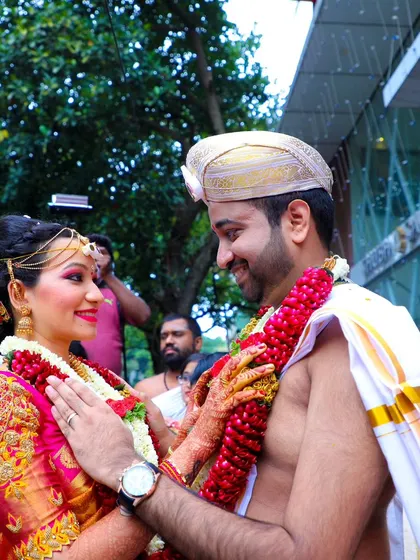 A candid moment of love and happiness between the bride and groom after their wedding ceremony.