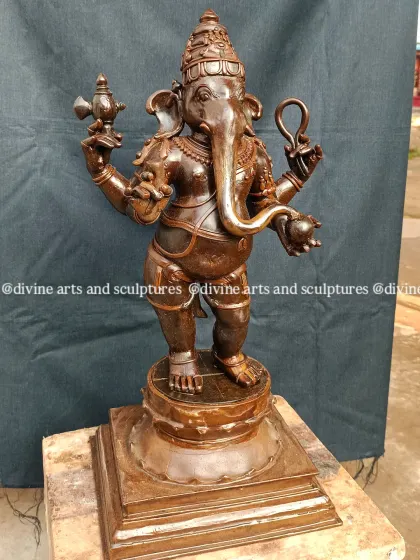 A slightly different angle of the standing Ganesha wax model, showing the fine details on his crown and the gentle curve of his trunk. This is a classic form often created for home decor and personal worship.