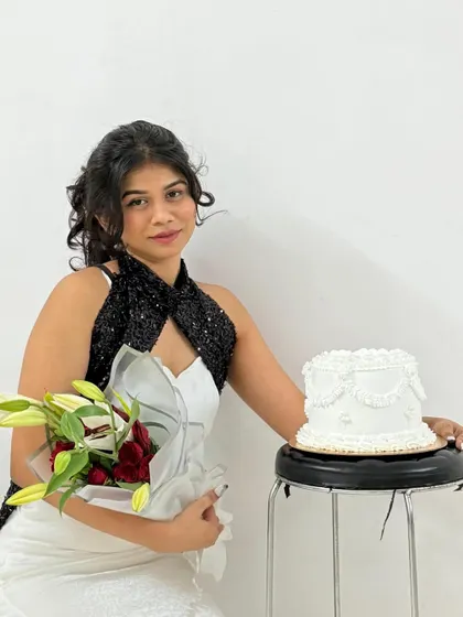 Another lovely shot from the same birthday photoshoot, featuring our classic white piped cake.