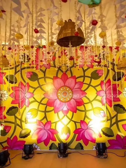 This vibrant, floral-inspired backdrop is perfect for a Mehendi or Haldi ceremony. I used uplighters at the base to make the colors pop and bring the beautiful artwork to life.