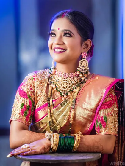 A joyful upward glance from the bride during her reception. The lighting highlights her happiness and the sparkle of her outfit.
