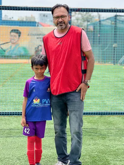 A father and son duo at our summer camp event. We encourage parental involvement and love seeing families bond over football.