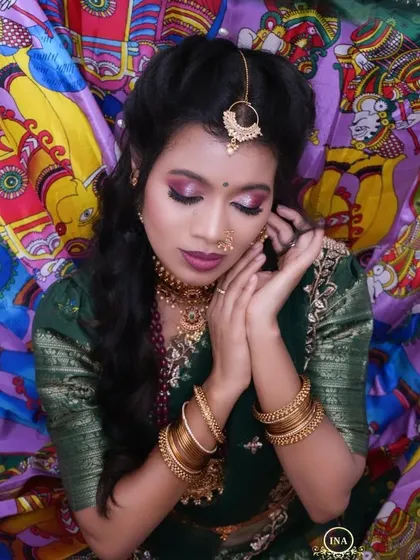 A close-up shot highlighting the beautiful makeup and jewelry paired with my traditional half saree rental.