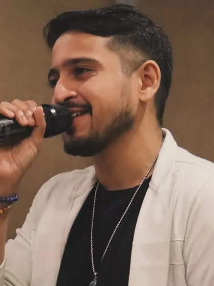 A close-up shot while performing at a Diwali party. I focus on delivering every note with passion and energy.