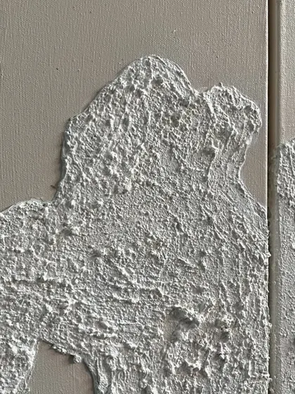 A macro shot of the rough, concrete-like texture I create as a base for my gold leaf artworks. The texture itself is a key part of the design.