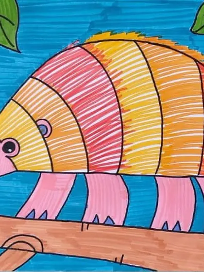 This drawing of an armadillo with a rainbow-colored shell is a beautiful example of creative color use. We teach color theory in a way that encourages experimentation and personal expression.
