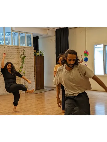 The dynamic energy of our contemporary class is captured in this shot of dancers moving across the floor.