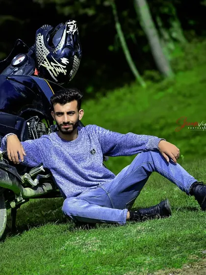 A relaxed portrait of a man with his bike. This kind of lifestyle shot is great for showing off hobbies and personality.
