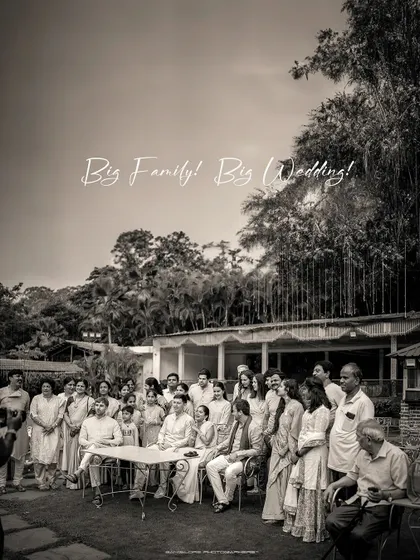 A classic black and white photo of the entire wedding party. This "Big Family, Big Wedding" shot is a timeless keepsake of everyone who came to celebrate.