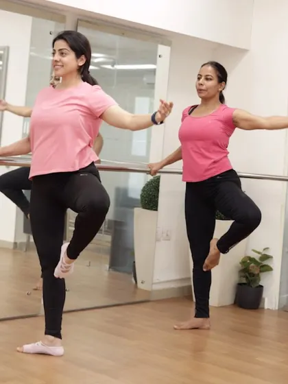 Welcome to happy hour at our favorite barre. This image captures the essence of our ActivBarre classes: sculpting, stretching, and sweating with a smile.