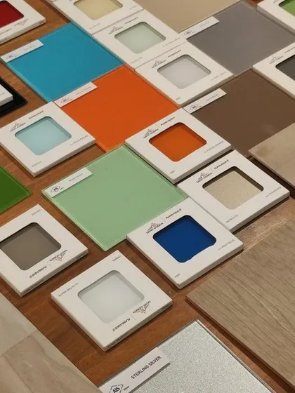 Material selection is a critical step where we define the tactile and visual character of a space. Here, a wide array of glass, wood, and metal samples are reviewed to find the perfect palette.