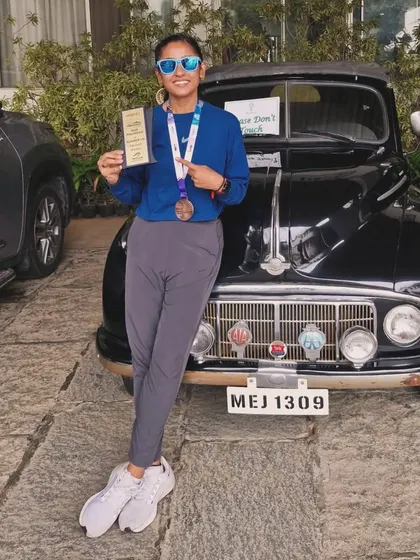 A moment to celebrate the win. Posing with my medal and trophy after a strong performance.