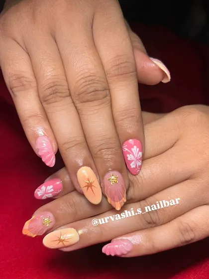 This trendy set combines multiple elements for a fun, summery vibe. It features sculpted shells, hand-painted florals, and starburst accents in a warm pink and orange color palette.
