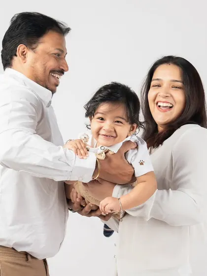 The pure, uncontainable joy of playing with your child. The laughter in this photo is contagious and shows the beautiful connection this family shares.