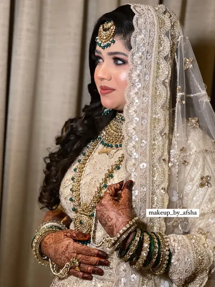 This bride's white and green lehenga is so elegant. I created a soft, glowing makeup look with a focus on her eyes.