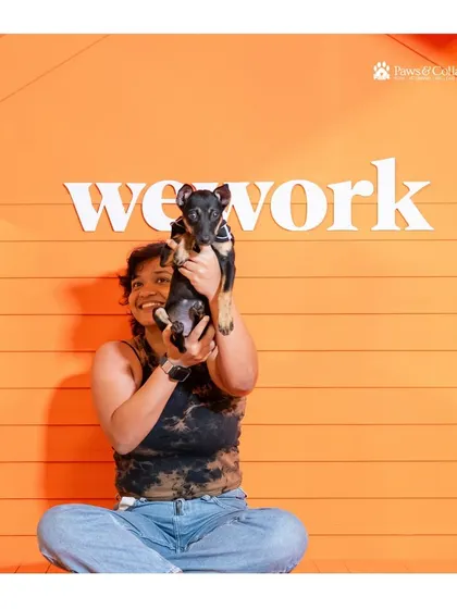 A new pet parent proudly holds up her tiny adopted puppy at the WeWork adoption event. Every adoption is a victory, and we are so happy to help facilitate these life-changing connections.