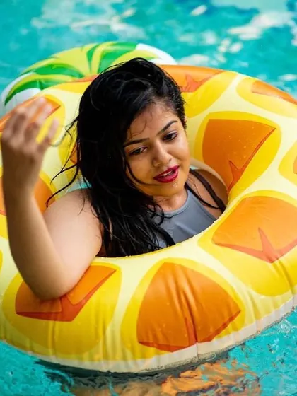 A guest enjoying a fruity floatie to match the summer vibes.