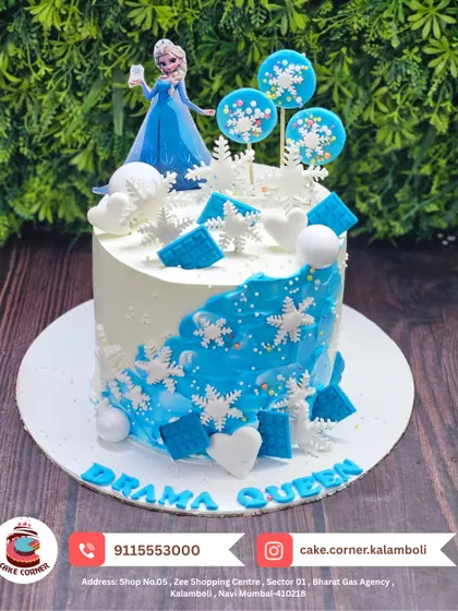 A "Drama Queen" Frozen cake for the ultimate Elsa fan. This design features an Elsa doll, snowflakes, and lollipops for an extra special touch.
