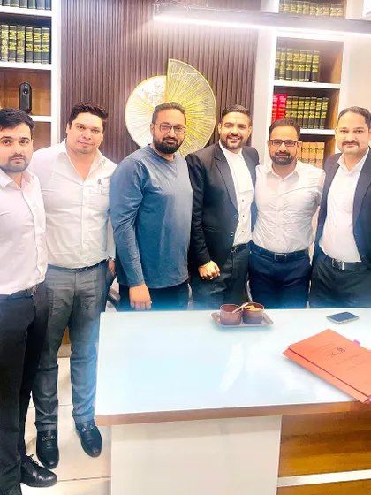 In my office with colleagues and a former intern. It brings me immense pride to see my mentees build their own successful careers.