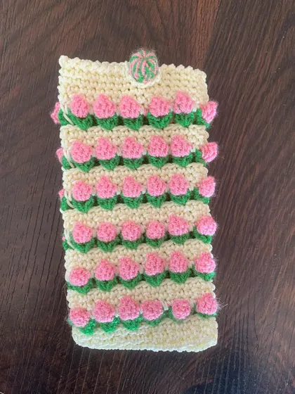A detailed shot of the pink tulip mobile pouch, highlighting the 3D effect of the flowers.