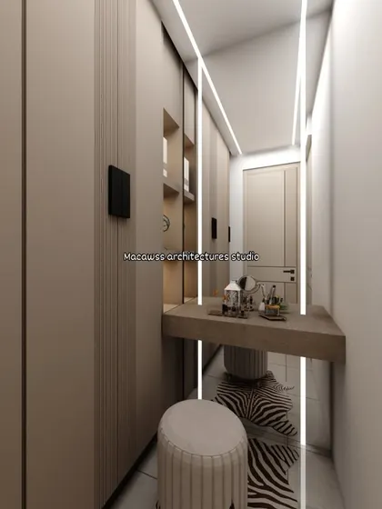 This is a dedicated dressing area I designed within a bedroom, featuring a sleek vanity with vertical lighting. The full-length mirror and ample storage make it a highly functional space.