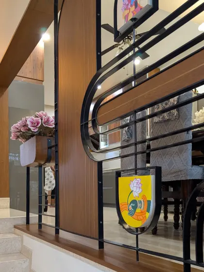 A detailed shot of the partition's hand-crafted art panel, which incorporates traditional motifs into a modern design.