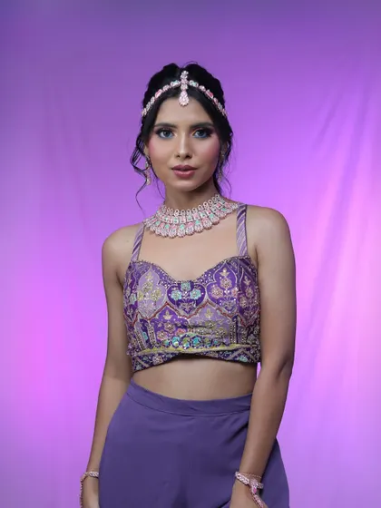 The full ensemble for this modern party look. The embroidered top and pastel jewelry create a chic and trendy vibe.