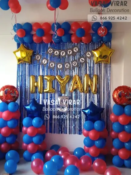 A superhero celebration ready for action. This setup uses a classic red and blue color scheme with a shimmering backdrop and balloon columns topped with Spider-Man foil balloons, perfect for any young hero's birthday.
