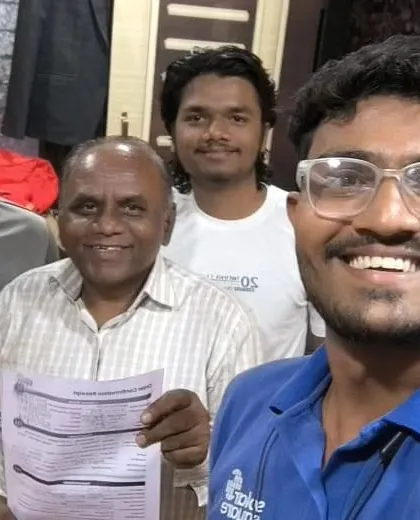 Our team member takes a selfie with a customer holding his new solar agreement.