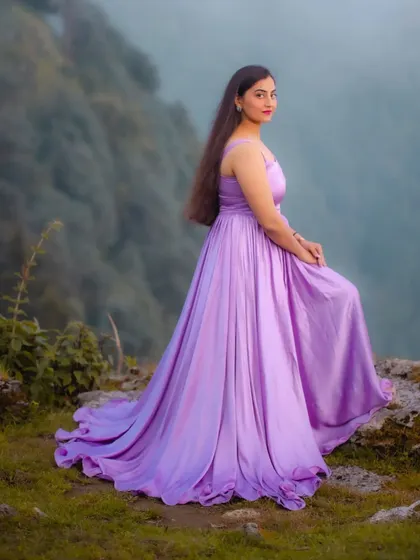This lavender gathered dress was custom-made for a client's pre-wedding shoot in the mountains. The soft, flowing fabric and simple silhouette were chosen to complement the misty, ethereal backdrop.