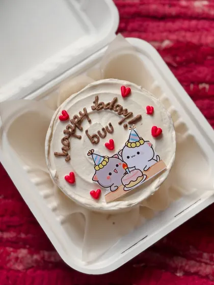 A sweet birthday cake featuring the adorable "Bubu and Dudu" bear characters celebrating with a tiny cake and party hats. It's perfect for a cute cartoon lover.