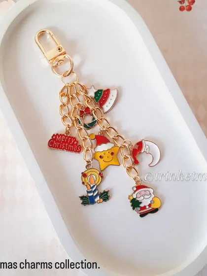 Another look at my Christmas charm keychain, displayed on a festive background. It's a joyful accessory that captures the spirit of the season.