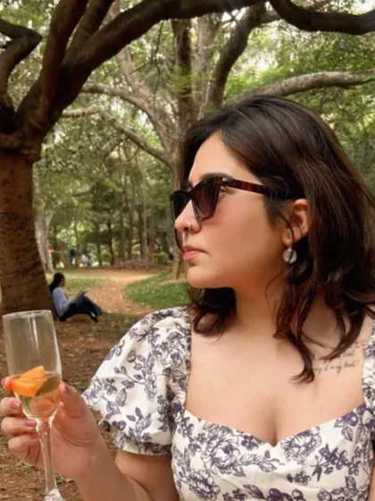 Sipping on a drink at my park picnic. It's the small details and quiet moments that make up a beautiful life.