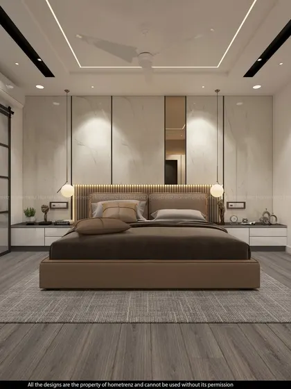 This master bedroom features a stunning marble-paneled wall and a barn-style sliding door. The warm wood tones and grey flooring create a sophisticated, contemporary look.