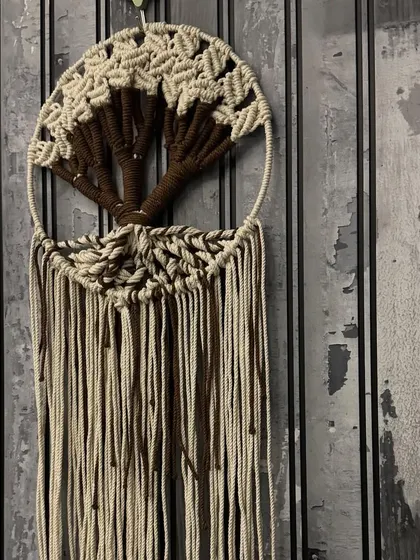 The Tree of Life is such a powerful symbol, and I enjoy weaving that meaning into my art. This macrame dream catcher features an intricate tree design, handcrafted with natural cotton cords to bring a sense of peace and connection to your space.