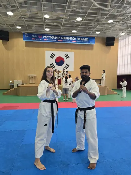 With a fellow black belt from another nation at the 2024 WT Partnership Taekwondo Program. The global community of Taekwondo is strong.