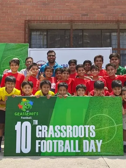 A group photo of our players and coaches at the 10th AFC Grassroots Football Day, a successful event promoting youth football.