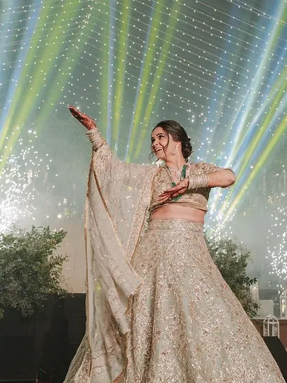 A stunning bride solo moment captured with pyrotechnics in the background. We help coordinate with planners to ensure your performance has maximum impact.