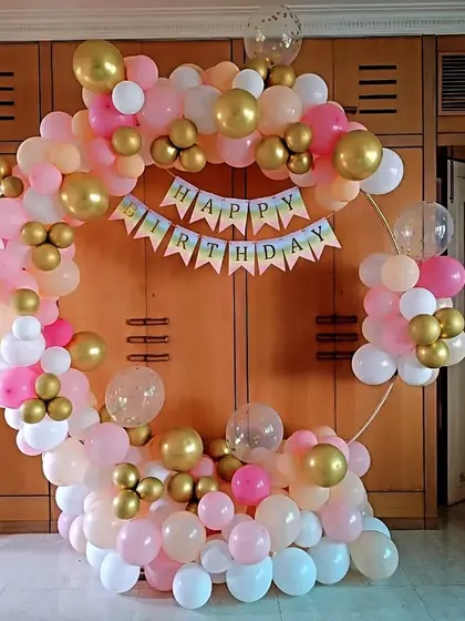 A pastel-colored birthday ring with pink, peach, and gold balloons, perfect for a soft and pretty theme.