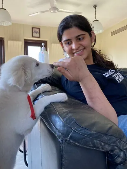 A gentle moment with a puppy during my training. My approach is always rooted in kindness and building trust, especially with young dogs who are just learning about the world.