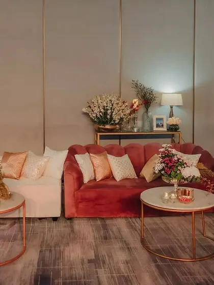 Creating cozy corners within a grand space is key. This lounge area featured plush velvet sofas in rich tones, providing a comfortable and stylish space for guests to relax and mingle.