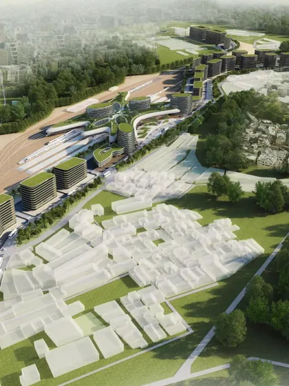 A masterplan view showing the integration of the new station and development with the existing urban fabric and railway lines.