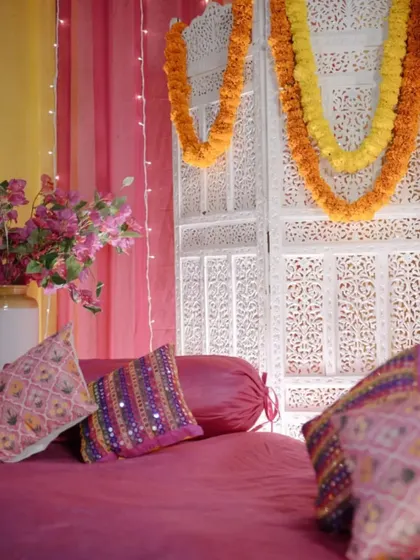 A close-up of the Mehendi seating, showing the sequined and embroidered cushions that add a touch of glamour to the traditional setup.