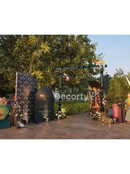 The entrance walkway for the Vrindavan event, lined with various themed decor elements to create an immersive journey for guests.