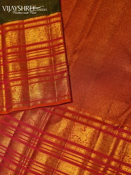 The interplay of colors and textures in this red and green Korvai Kanjivaram makes it a true work of art.